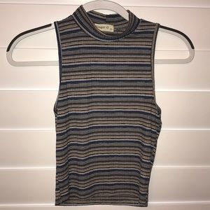 A multi colored turtle neck tank top